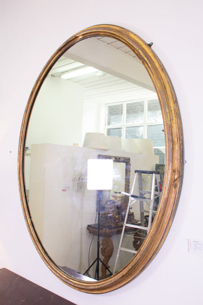A Large Oval Victorian Gitlwood Mirror