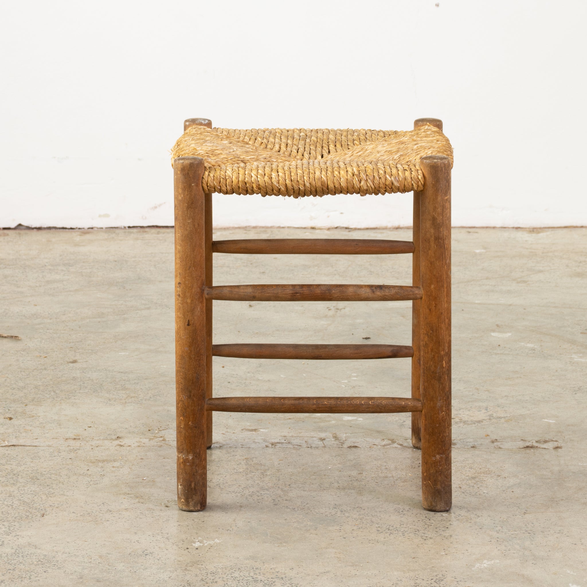 Rush Caned Low stool in the style of Charlotte Periand – The Vault