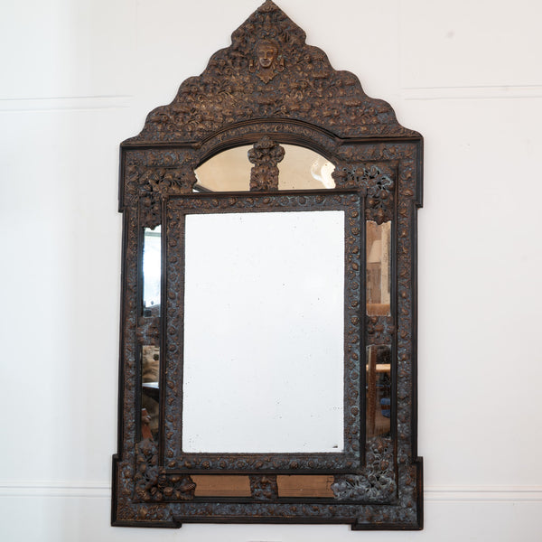 A large Flemish Baroque Repousse Brass Cushion Mirror