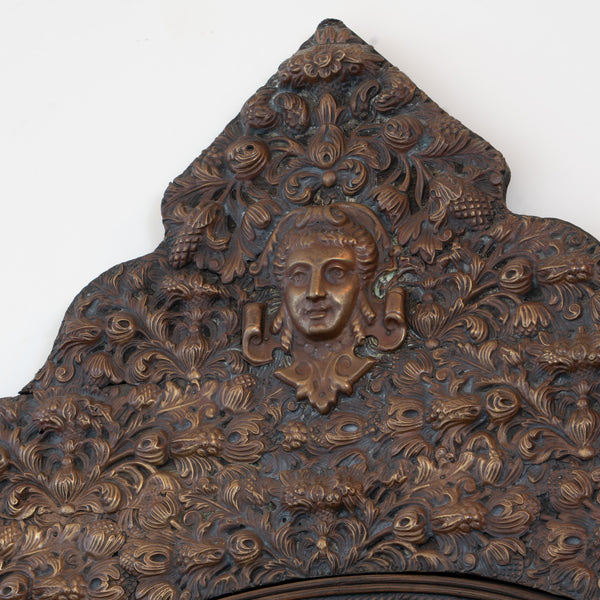 A large Flemish Baroque Repousse Brass Cushion Mirror