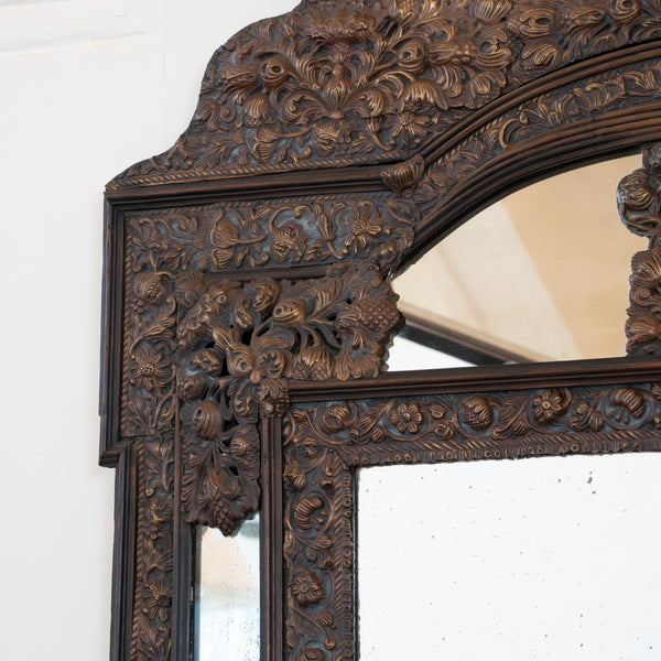 A large Flemish Baroque Repousse Brass Cushion Mirror