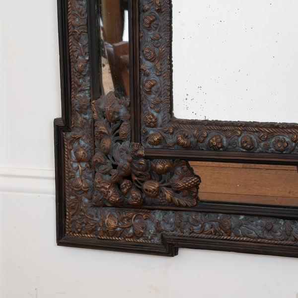A large Flemish Baroque Repousse Brass Cushion Mirror