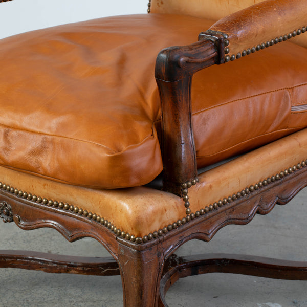 A Regence Fauteuil Upholstered in Cognac Leather