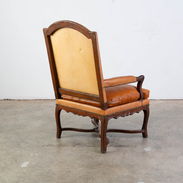 A Regence Fauteuil Upholstered in Cognac Leather