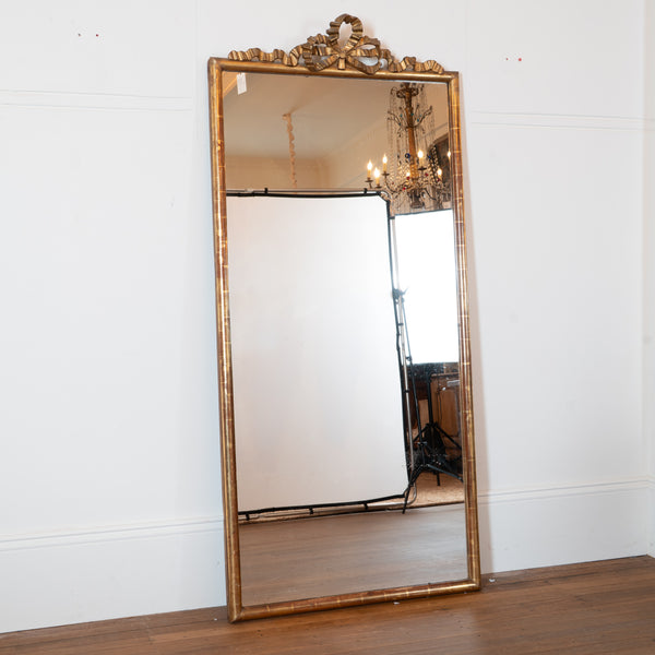 A Louis XVI Style Giltwood Mirror with Ribbon-Tied Cresting, French, Late 19th / Early 20th Century