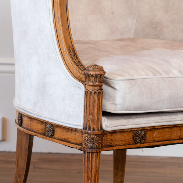 A Pair of French Directoire Style Carved Beechwood Bergères en Gondole, Late 19th / Early 20th Century