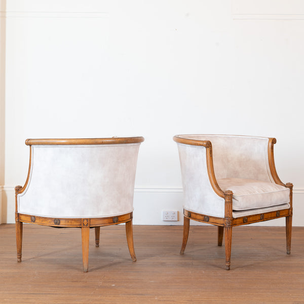 A Pair of French Directoire Style Carved Beechwood Bergères en Gondole, Late 19th / Early 20th Century