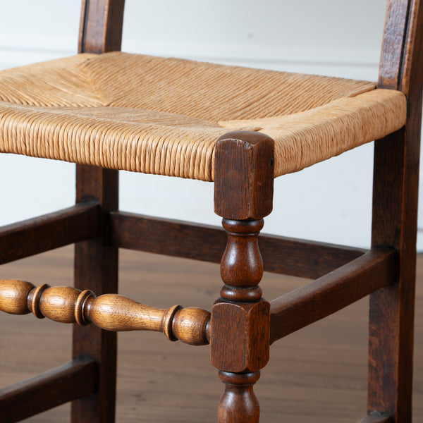 A Set of Eight French Oak and Rush Dining Chairs