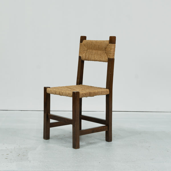 A set of Six rush and beech dining chairs, in the manner of Charlotte Perriand.