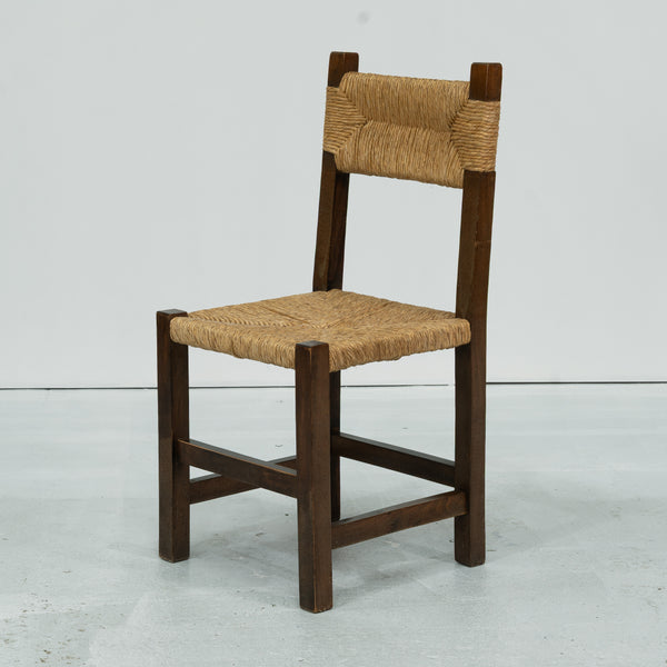A set of Six rush and beech dining chairs, in the manner of Charlotte Perriand.
