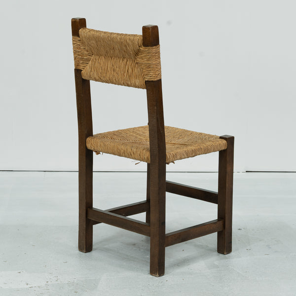 A set of Six rush and beech dining chairs, in the manner of Charlotte Perriand.