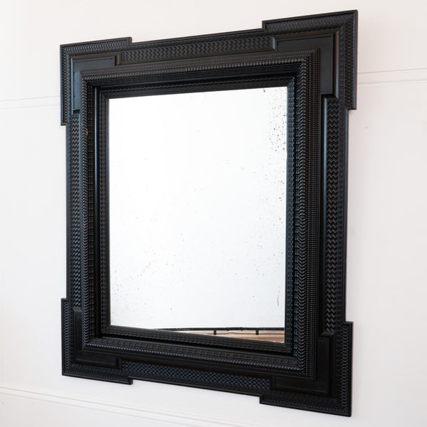 A Large 19th Century Italian Ebonised Square Mirror with outset corners