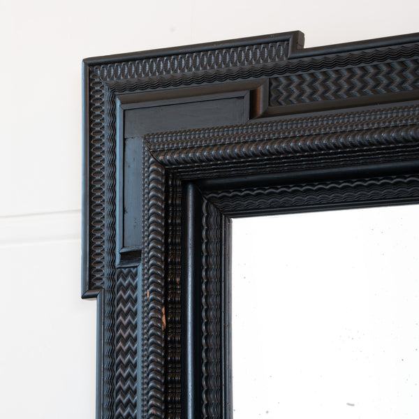 A Large 19th Century Italian Ebonised Square Mirror with outset corners