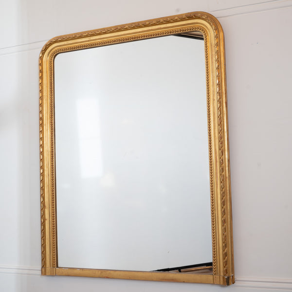 A Large French Louis-Philippe Period Giltwood and Gesso Overmantel Mirror
