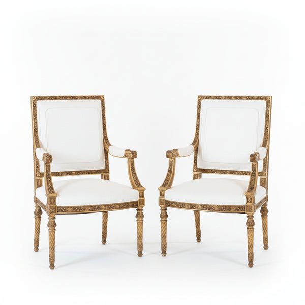 A pair of French Louis XVI style giltwood Fauteuils