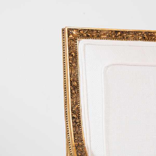 A pair of French Louis XVI style giltwood Fauteuils