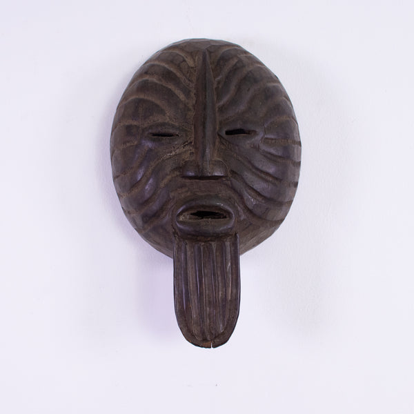 A Large & Deeply Carved Wood Ancestral Mask Perforation at the Eyes