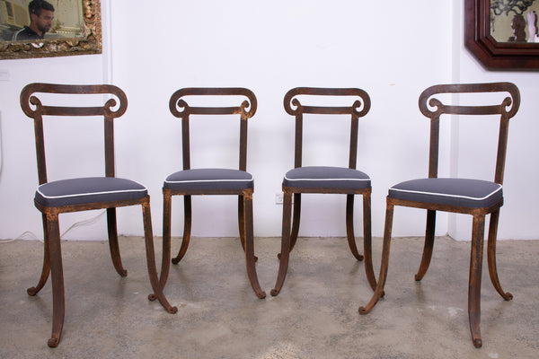 A Set of Four Klismos Style Forged Iron Chairs