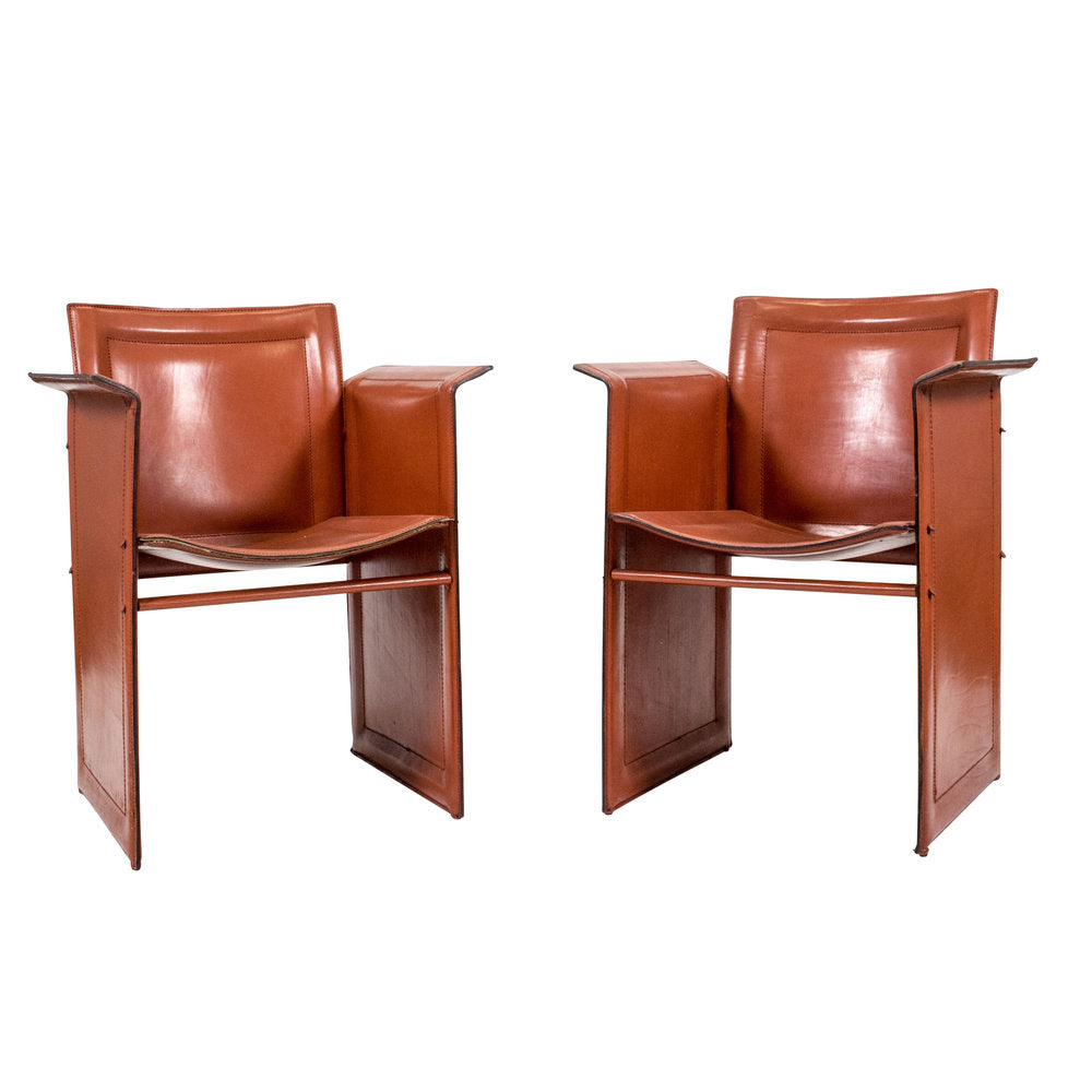 A pair of leather Korium chairs by Tito Agnoli