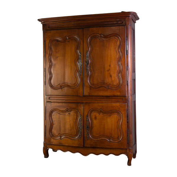 A Provincial Louis XV Armoire in Panelled cherrywood