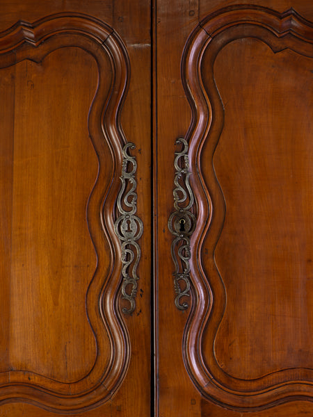 A Provincial Louis XV Armoire in Panelled cherrywood