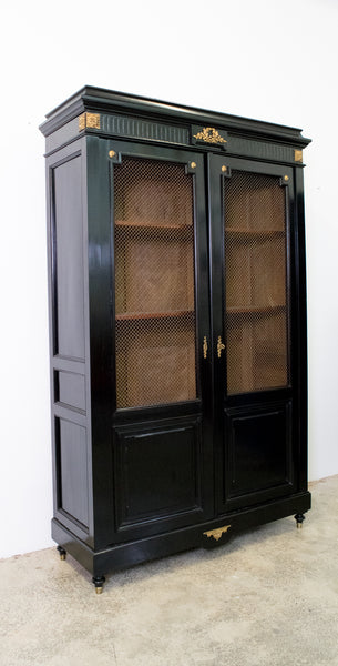 A Pair of Ebonised Louis XVI Style Two Door Bibliotheque