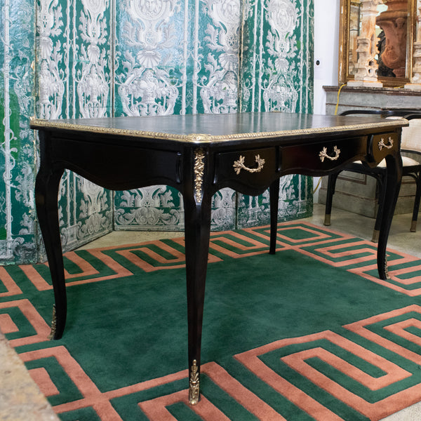 A Louis XV style Ebonised Bureau Plat