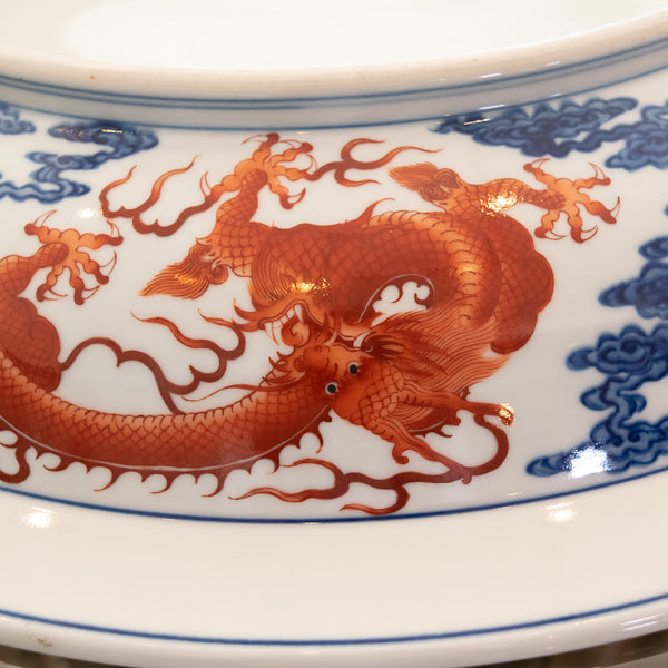 A Chinese Blue and Iron Red “Nine Dragon” Porcelain Charger