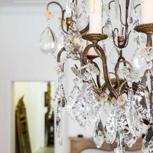 A Louis XV style Bronze and Crystal 8 Light Chandelier