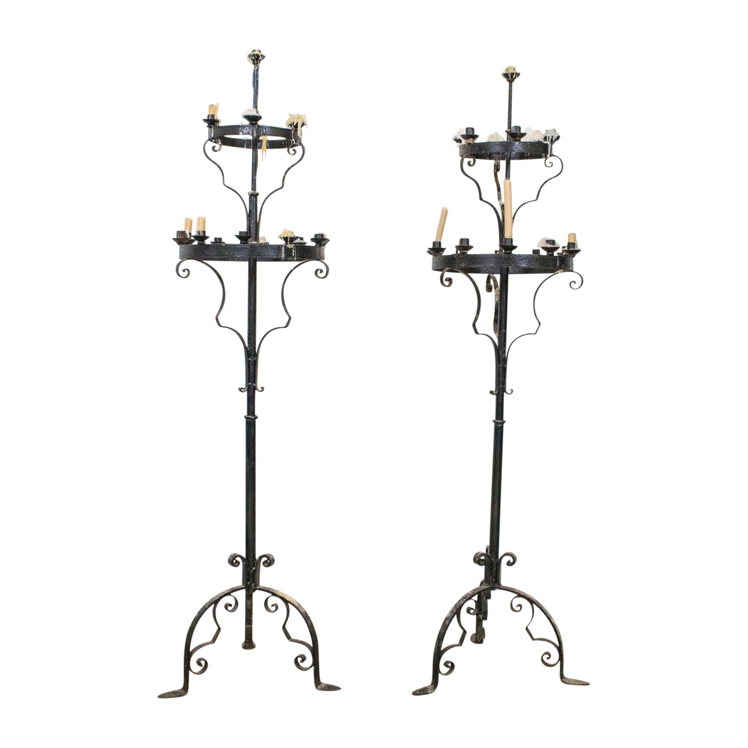 A Pair of Black Painted Wrought Iron Candle Sticks