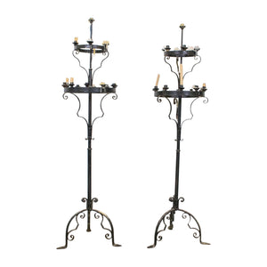 A Pair of Black Painted Wrought Iron Candle Sticks