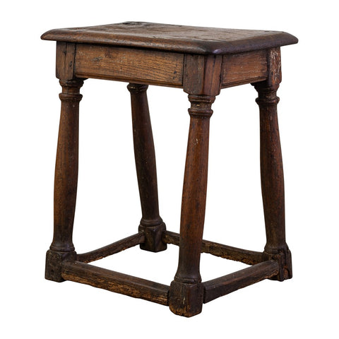 AN ANTIQUE ENGLISH OAK STOOL WITH PEG JOINT CONSTRUCTION